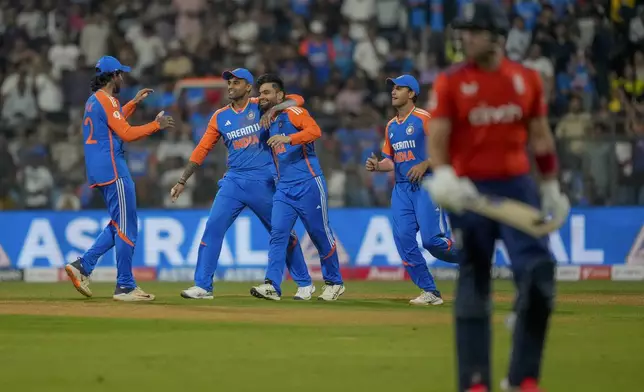 India's players celebrates the wicket of England's Liam Livingstone, right, during the fifth Twenty20 cricket match between India and England at Wankhede Stadium in Mumbai, India, Sunday, Feb. 2, 2025.(AP Photo/Rafiq Maqbool)