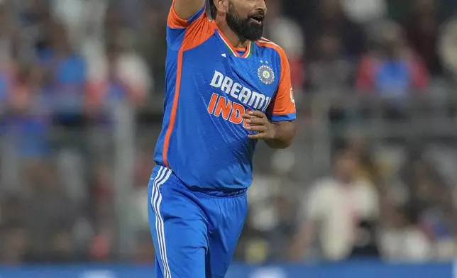 India's Mohammed Shami successfully appeals for the wickets of England's Mark Wood during the fifth Twenty20 cricket match between India and England at Wankhede Stadium in Mumbai, India, Sunday, Feb. 2, 2025.(AP Photo/Rafiq Maqbool)