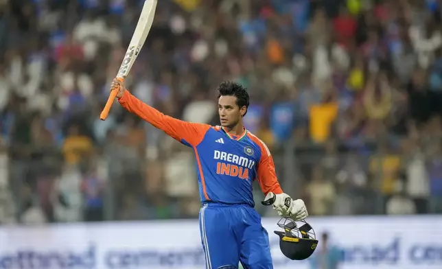 India's Abhishek Sharma acknowledges the crowd as he leaves the ground after losing his wicket during the fifth Twenty20 cricket match between India and England at Wankhede Stadium in Mumbai, India, Sunday, Feb. 2, 2025.(AP Photo/Rafiq Maqbool)