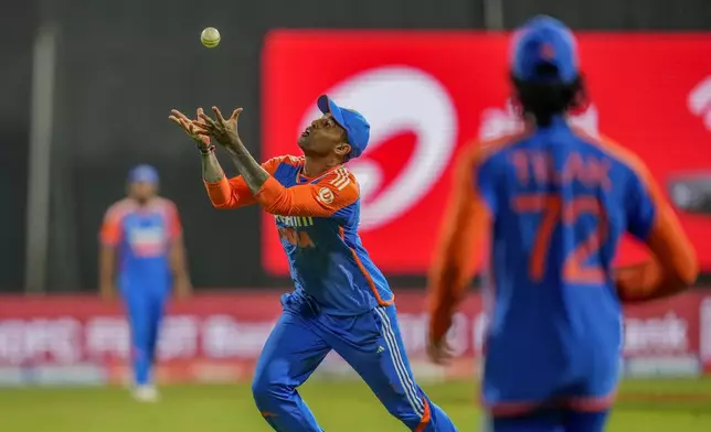 India's captain Suryakumar Yadav prepares to take the catch to dismiss England's Jamie Overton during the fifth Twenty20 cricket match between India and England at Wankhede Stadium in Mumbai, India, Sunday, Feb. 2, 2025.(AP Photo/Rafiq Maqbool)