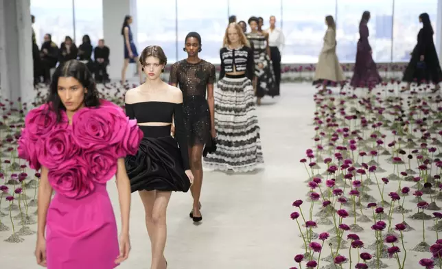 Models walk the runway during the Carolina Herrera Fall/Winter 2025 fashion show as part of New York Fashion Week on Monday, Feb. 10, 2025, in New York. (Photo by Charles Sykes/Invision/AP)