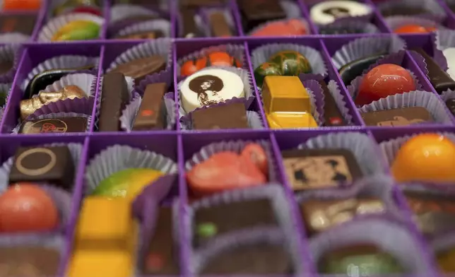 Artisan chocolates are displayed in a box at The Chocolate Line in Bruges, Belgium, Thursday, Feb. 6, 2025. (AP Photo/Virginia Mayo)