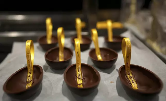 Chocolate eggs dry in the workshop at The Chocolate Line in Bruges, Belgium, Thursday, Feb. 6, 2025. (AP Photo/Virginia Mayo)