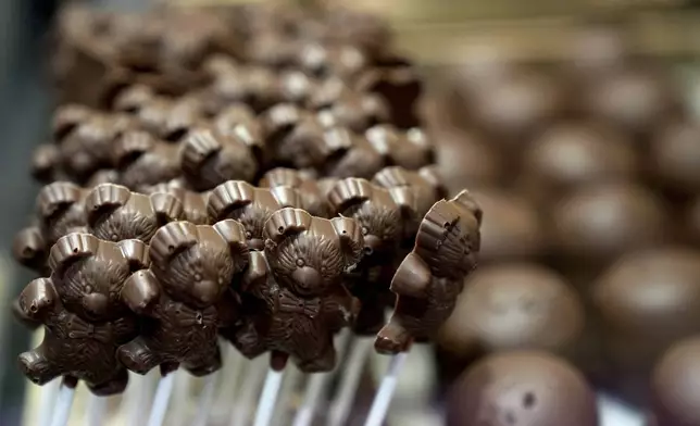 Chocolate lollypops are displayed in a glass sales case at The Chocolate Line in Bruges, Belgium, Thursday, Feb. 6, 2025. (AP Photo/Virginia Mayo)