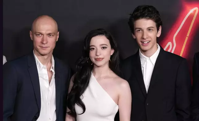 FILE - Cast members, from left, Yura Borisov, Mikey Madison and Mark Eydelshteyn, cast members in "Anora," pose together at the premiere of the film, Tuesday, Oct. 1, 2024, at the Vista Theatre in Los Angeles. (AP Photo/ Chris Pizzello, File)