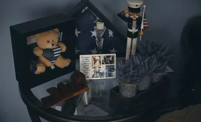 A memorial Sharline Volcy set up in honor of her husband, Ronald Donat, is seen Monday, Feb. 3, 2025, at her home in Orange, N.J. (AP Photo/Andres Kudacki)