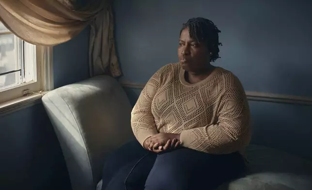 Widow Sharline Volcy poses for a portrait on Monday, Feb. 3, 2025, in Orange, N.J. (AP Photo/Andres Kudacki)