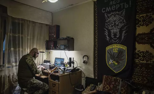 A Ukrainian soldier repairs a FPV drone in a drone repair workshop close to the front line near Siversk, Donetsk region, Ukraine, Thursday, Feb. 6, 2025. (AP Photo/Roman Chop)