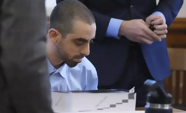Hadi Matar sits at the defense table before the start of the second day of his trial at the Chautauqua County Courthouse, Tuesday, Feb. 11, 2025, in Mayville, N.Y. Matar is charged with stabbing famed author Salman Rushdie. (AP Photo/Gene J. Puskar)