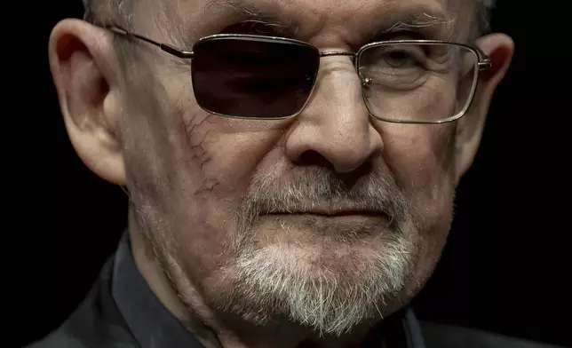 FILE - Author Salman Rushdie poses for a portrait to promote his book "Knife: Meditations After an Attempted Murder", at the Deutsches Theater in Berlin, Germany, May 16, 2024. (AP Photo/Ebrahim Noroozi, File)