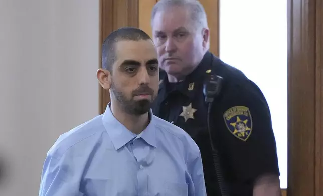 Hadi Matar is escorted into the courtroom at the Chautauqua County Courthouse ahead of the second day in his trial, Tuesday, Feb. 11, 2025, in Mayville, N.Y. Matar is charged with stabbing famed author Salman Rushdie. (AP Photo/Gene J. Puskar)