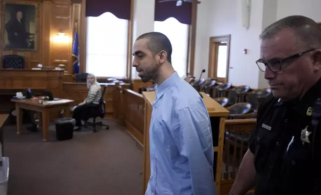 Hadi Matar is escorted into the courtroom at the Chautauqua County Courthouse ahead of the second day in his trial, Tuesday, Feb. 11, 2025, in Mayville, N.Y. Matar is charged with stabbing famed author Salman Rushdie. (AP Photo/Gene J. Puskar)