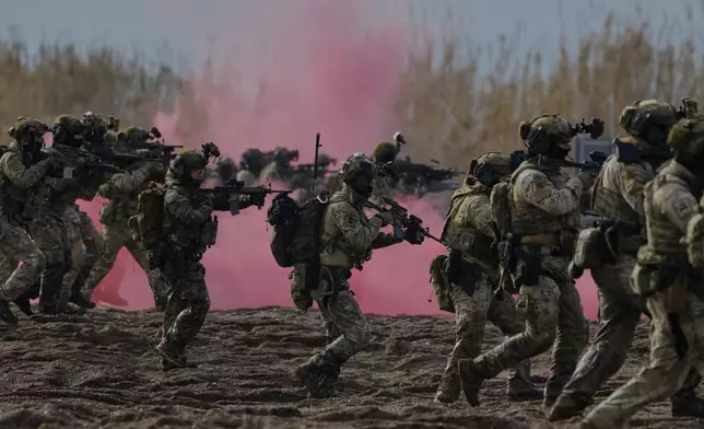 Special forces from Greece and Spain participate in the Steadfast Dart 2025 exercise, involving some 10,000 troops in three different countries from nine nations and represent the largest NATO operation planned this year, in Nea Anchialos, central Greece, Thursday, Feb. 13, 2025. (AP Photo/Thanassis Stavrakis)