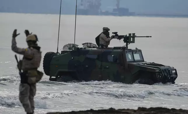 Special forces from Spain land on a beach as they participate in the Steadfast Dart 2025 exercise, involving some 10,000 troops in three different countries from nine nations and represent the largest NATO operation planned this year, in Nea Anchialos, central Greece, Thursday, Feb. 13, 2025. (AP Photo/Thanassis Stavrakis)