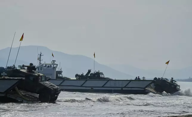 Special forces from Spain land on a beach as they participate in the Steadfast Dart 2025 exercise, involving some 10,000 troops in three different countries from nine nations and represent the largest NATO operation planned this year, in Nea Anchialos, central Greece, Thursday, Feb. 13, 2025. (AP Photo/Thanassis Stavrakis)