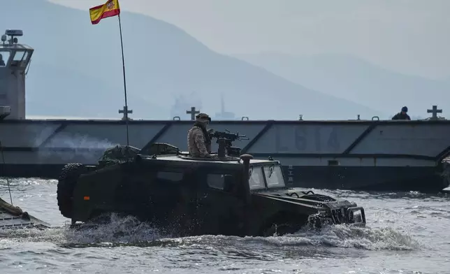 Special forces from Spain land on a beach as they participate in the Steadfast Dart 2025 exercise, involving some 10,000 troops in three different countries from nine nations and represent the largest NATO operation planned this year, in Nea Anchialos, central Greece, Thursday, Feb. 13, 2025. (AP Photo/Thanassis Stavrakis)