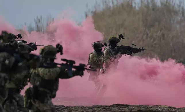 Special forces from Greece participate in the Steadfast Dart 2025 exercise, involving some 10,000 troops in three different countries from nine nations and represent the largest NATO operation planned this year, in Nea Anchialos, central Greece, Thursday, Feb. 13, 2025. (AP Photo/Thanassis Stavrakis)