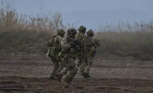 Special forces from Spain take part in the Steadfast Dart 2025 exercise, involving some 10,000 troops in three different countries from nine nations and represent the largest NATO operation planned this year, in Nea Anchialos, central Greece, Thursday, Feb. 13, 2025. (AP Photo/Thanassis Stavrakis)