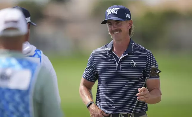 Jake Knapp smiles as he finishes with a 59 in the first round of the Cognizant Classic golf tournament, Thursday, Feb. 27, 2025, in Palm Beach Gardens, Fla. (AP Photo/Rebecca Blackwell)