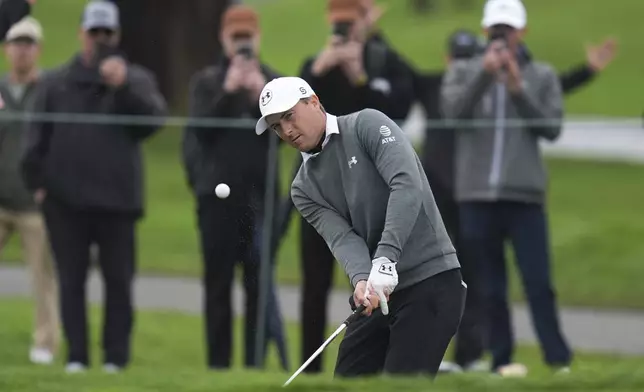 Jordan Spieth chips on the sixth green of the South Course at Torrey Pines during the first round of the Genesis Invitational golf tournament Thursday, Feb. 13, 2025, in San Diego. (AP Photo/Gregory Bull)