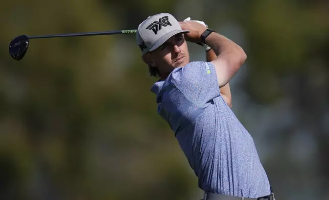 Jake Knapp hits on the second tee of the South Course at Torrey Pines during the third round of the Genesis Invitational golf tournament Saturday, Feb. 15, 2025, in San Diego. (AP Photo/Gregory Bull)