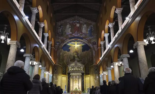 Pope's Vicar for Rome, Cardinal Baldassare Reina celebrates mass for the health of Pope Francis at the Church of the Argentinas, Santa Maria Addolorata in Rome, Italy Tuesday, Feb. 25, 2025. (AP Photo/Kirsty Wigglesworth)