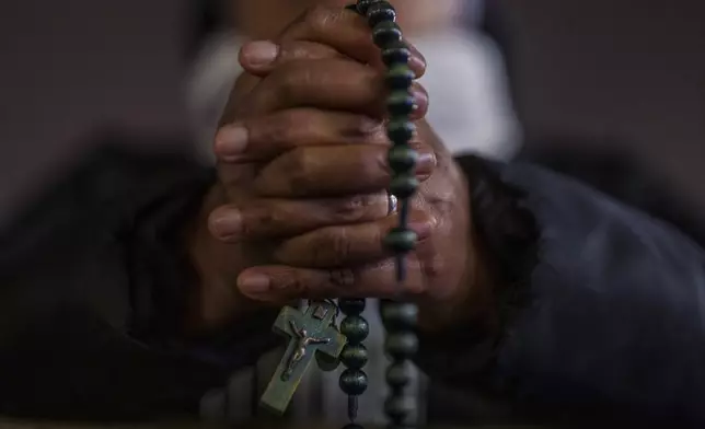 A Catholic nun attends a prayer of the Rosary for Pope Francis in St. Peter's Square at The Vatican, Monday, Feb. 24, 2025. (AP Photo/Bernat Armangue)