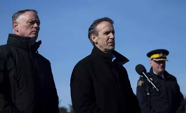 Canada's fentanyl czar Kevin Brosseau, center, speaks during a press conference following a tour of the Canada Border Services Agency Lansdowne port of entry in Lansdowne, Ontario, on Wednesday, Feb. 12, 2025. (Spencer Colby/The Canadian Press via AP)