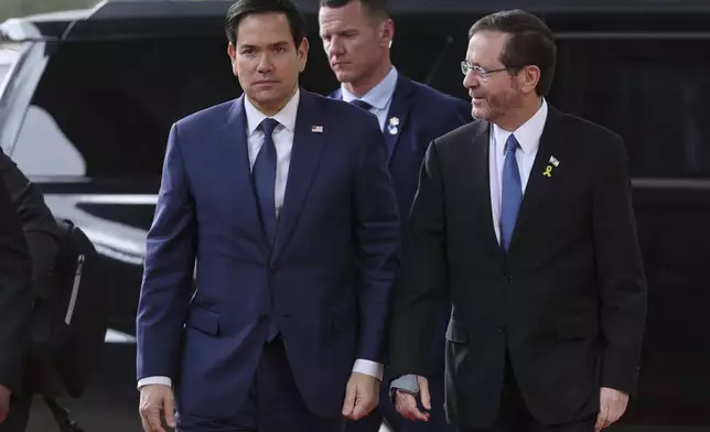 U.S. Secretary of State Marco Rubio, left, meets with Israeli president Isaac Herzog, right, in Jerusalem, Israel, Sunday Feb. 16, 2025. (Abir Sultan/Pool Photo via AP)