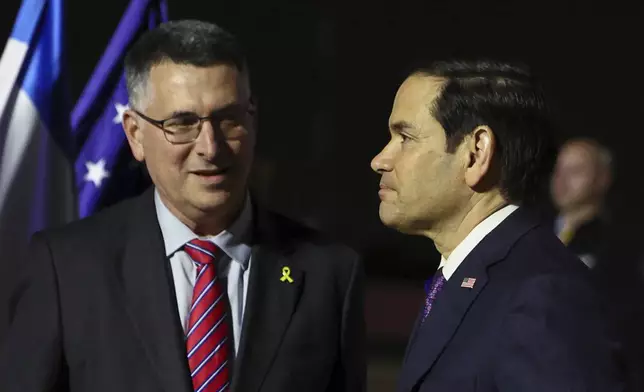 Israel's Foreign Minister Gideon Sa'ar welcomes U.S. Secretary of State Marco Rubio as he arrives in Israel, on the first leg of his Middle East trip, in Tel Aviv, Israel, on Saturday, Feb. 15, 2025. (Evelyn Hockstein/Pool Photo via AP)