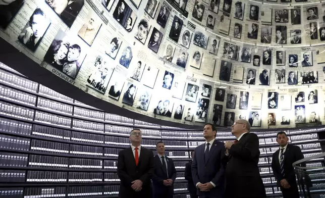 U.S. Secretary of State Marco Rubio, front center, accompanied by Chairman of Yad Vashem Dani Dayan, front right, and Israel's Foreign Minister Gideon Sa'ar, left, tours Yad Vashem, the World Holocaust Remembrance Center, in Jerusalem, Israel, Sunday Feb. 16, 2025. (Evelyn Hockstein, Pool Photo via AP)
