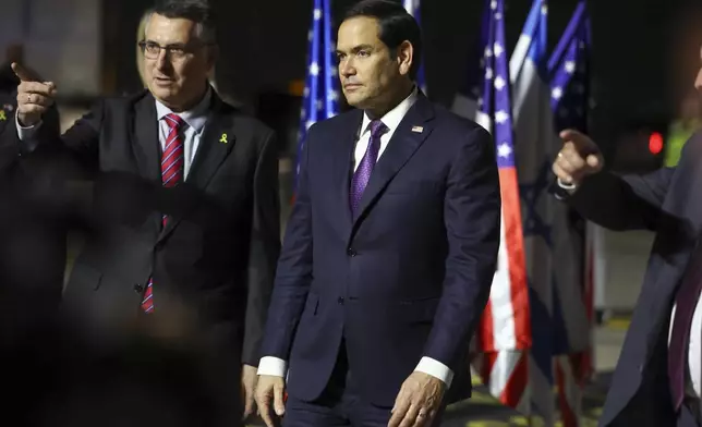 Israel's Foreign Minister Gideon Sa'ar welcomes U.S. Secretary of State Marco Rubio as he arrives in Israel, on the first leg of his Middle East trip, in Tel Aviv, Israel, Saturday, Feb. 15, 2025. (Evelyn Hockstein/Pool Photo via AP)