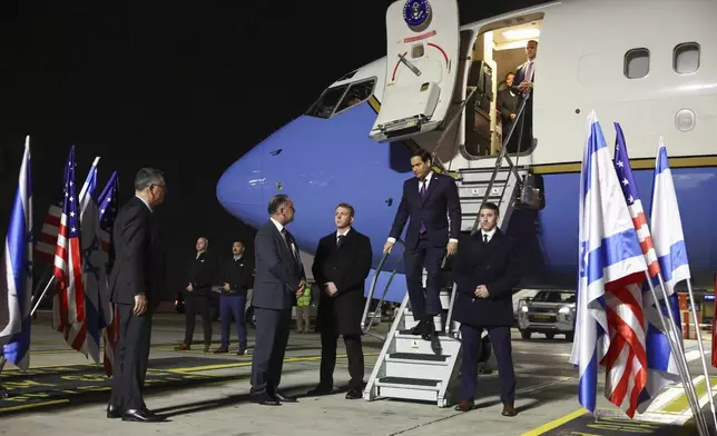 U.S. Secretary of State Marco Rubio arrives in Israel on the first leg of his Middle East trip, as Israel's Foreign Minister Gideon Sa'ar waits to welcome him, in Tel Aviv, Israel, Saturday, Feb. 15, 2025. (Evelyn Hockstein/Pool Photo via AP)