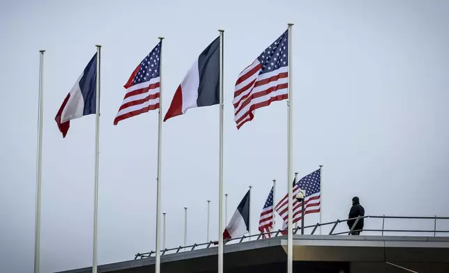 French and American flags flap in the wind prior to the arrival of United States Vice-President JD Vance at Paris Orly Airport, ahead of an Artificial Intelligence Action Summit taking place in Paris, Monday, Feb. 10, 2025. (AP Photo/Thomas Padilla)