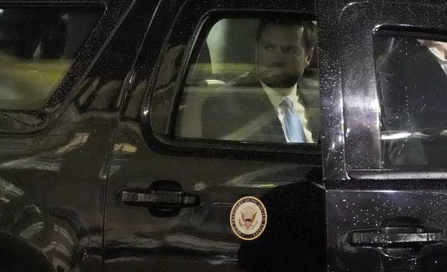 United States Vice-President JD Vance looks out of the car window as he arrives for a dinner at the Elysee Palace, during an event on the sidelines of the Artificial Intelligence Action Summit in Paris, Monday, Feb. 10, 2025. (AP Photo/Aurelien Morissard)