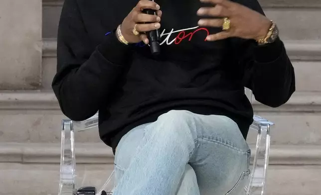 Musician and fashion designer Pharrell Williams speaks on a panel at the Grand Palais during the Artificial Intelligence Action Summit in Paris, Tuesday, Feb. 11, 2025. (AP Photo/Michel Euler)