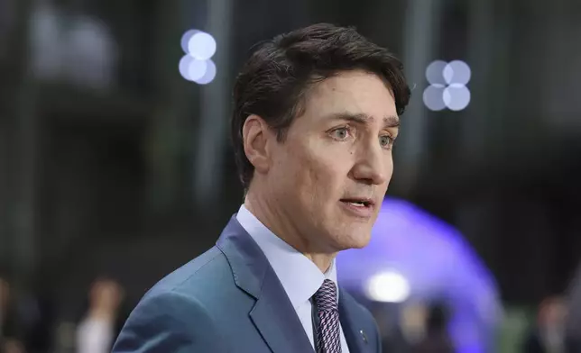 Canada's Prime Minister Justin Trudeau arrives at the Grand Palais for the Artificial Intelligence Action Summit in Paris, Tuesday, Feb. 11, 2025. (AP Photo/Thomas Padilla)