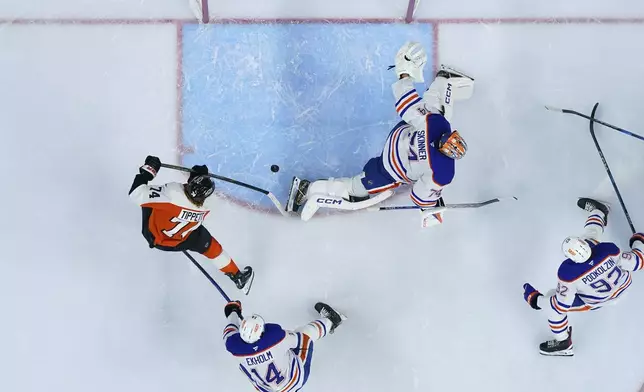 Philadelphia Flyers' Owen Tippett (74) scores a goal against Edmonton Oilers' Stuart Skinner (74) during the second period of an NHL hockey game, Saturday, Feb. 22, 2025, in Philadelphia. (AP Photo/Matt Slocum)