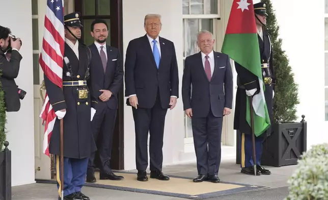 President Donald Trump greets Jordan's King Abdullah II, right, and Crown Prince Hussein at the White House, Tuesday, Feb. 11, 2025, in Washington. (AP Photo/Evan Vucci)