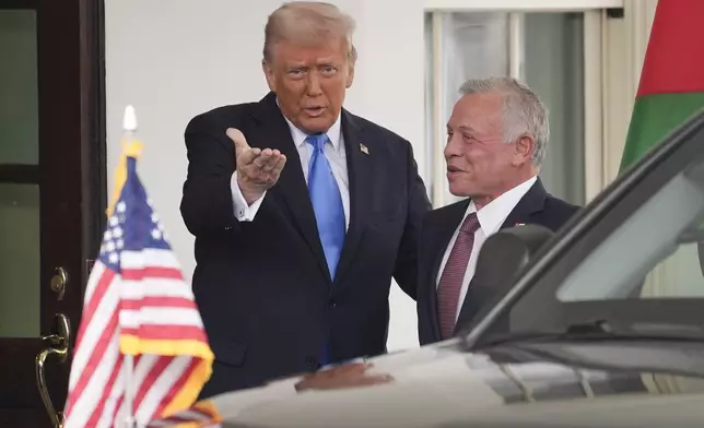 President Donald Trump greets Jordan's King Abdullah II at the White House, Tuesday, Feb. 11, 2025, in Washington. (AP Photo/Evan Vucci)