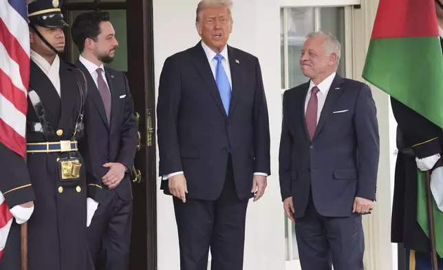 President Donald Trump greets Jordan's King Abdullah II, right, and Crown Prince Hussein at the White House, Tuesday, Feb. 11, 2025, in Washington. (AP Photo/Evan Vucci)