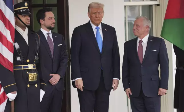 President Donald Trump greets Jordan's King Abdullah II, right, and Crown Prince Hussein at the White House, Tuesday, Feb. 11, 2025, in Washington. (AP Photo/Evan Vucci)