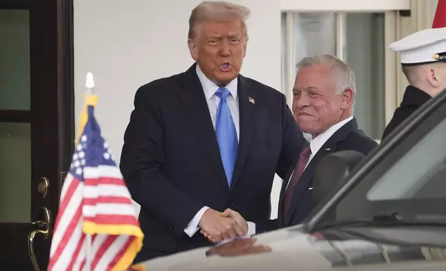 President Donald Trump greets Jordan's King Abdullah II at the White House, Tuesday, Feb. 11, 2025, in Washington. (AP Photo/Evan Vucci)
