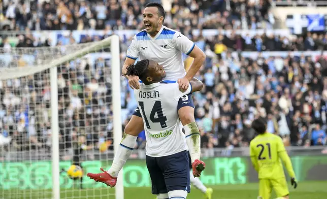 Lazio's Pedro, top, celebrates after scoring his side's fourth goal during a Serie A soccer match between Lazio and Monza, at Rome's Olympic Stadium, Sunday, Feb. 9, 2025 (Fabrizio Corradetti/LaPresse via AP)