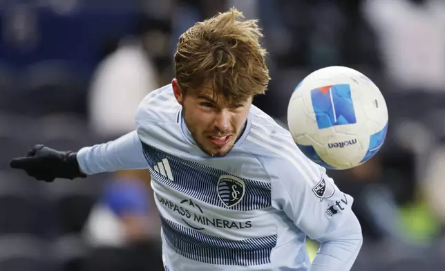 Sporting Kansas City midfielder Jake Davis heads the ball during a failed scoring attempt against Inter Miami during the second half of a CONCACAF Champions Cup soccer match, Wednesday, Feb. 19, 2025, in Kansas City, Kan. (AP Photo/Colin E. Braley