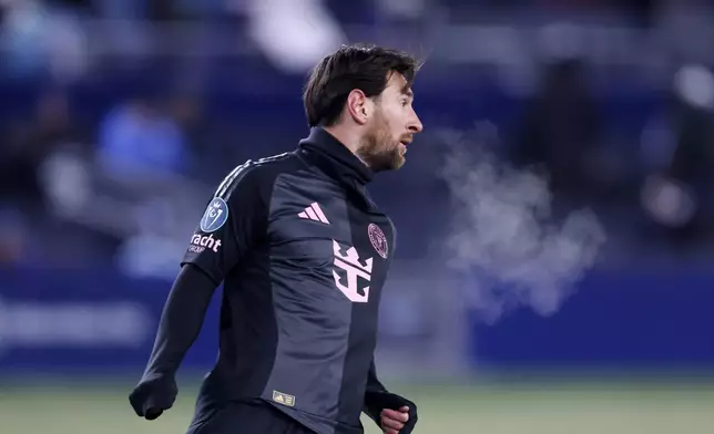 Inter Miami forward Lionel Messi looks down the pitch as he plays in subzero temperatures during the first half of a CONCACAF Champions Cup soccer match against Sporting Kansas City, Wednesday, Feb. 19, 2025, in Kansas City, Kan. (AP Photo/Colin E. Braley)