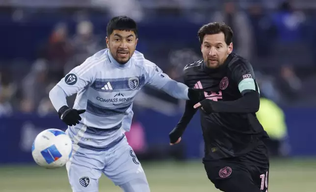 Sporting Kansas City midfielder Memo Rodríguez, left, and Inter Miami forward Lionel Messi compete for the ball during the first half of a CONCACAF Champions Cup soccer match, Wednesday, Feb. 19, 2025, in Kansas City, Kan. (AP Photo/Colin E. Braley)
