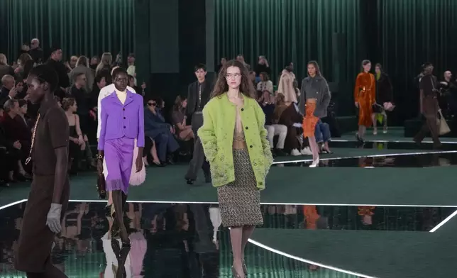 A model wears a creation as part of the Gucci Fall/Winter 2025-2026 men's and women's collection, presented in Milan, Italy, Tuesday, Feb. 25, 2025. (AP Photo/Luca Bruno)