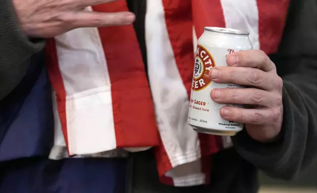 Marc Fogel holds an Iron City Beer as he speaks in the Diplomatic Reception Room at the White House with President Donald Trump, Tuesday, Feb. 11, 2025, in Washington. (Photo/Alex Brandon)