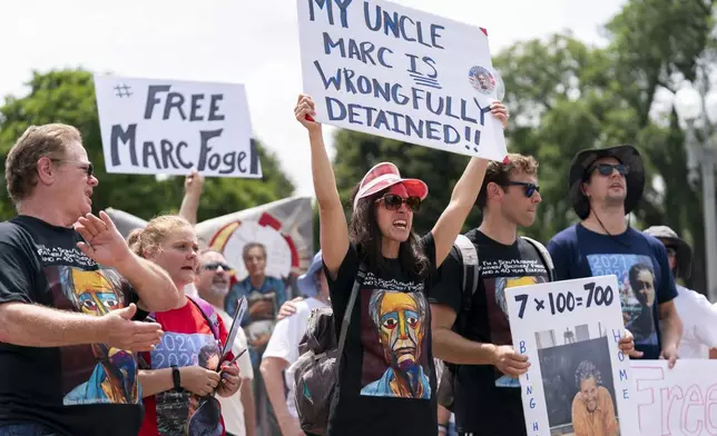 FILE - Ellen Keelan, center, and other family members rally outside the White House for the release of Marc Fogel, who has been detained in Russia since August 2021, July 15, 2023, in Washington. (AP Photo/Stephanie Scarbrough, File)